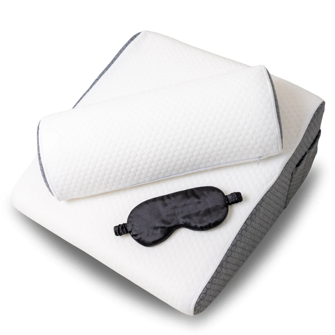 Travesseiro ortopédico Sillencia Sillencioem formato de cunha branco e cinza com bolso lateral e apoio cilíndrico com máscara de dormir.