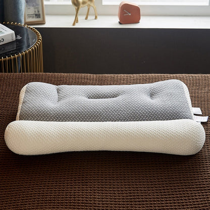 Detalhes do travesseiro ortopédico Sillencia ZenFiber em tons de cinza e branco destacando o design ergonômico