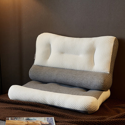 Travesseiro ortopédico Sillencia ZenFiber em tons de cinza e branco destacando o design ergonômico