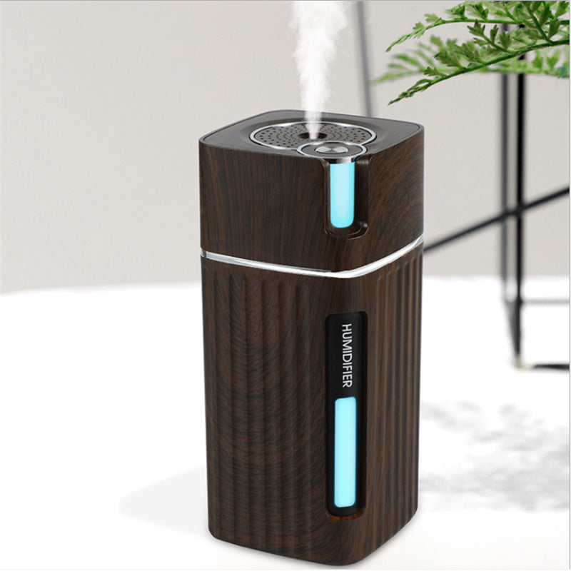 Visão técnica do umidificador de ar WoodMist marrom escuro mostrando o bocal de saída e o acabamento premiu