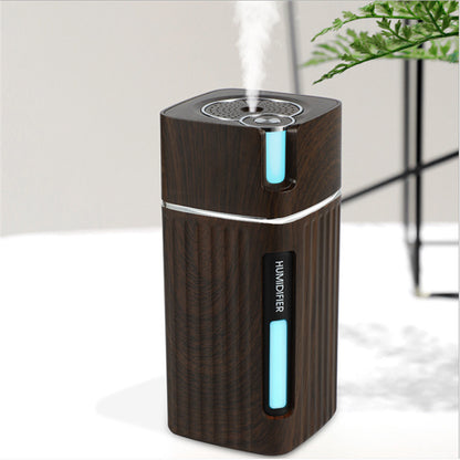 Visão técnica do umidificador de ar WoodMist marrom escuro mostrando o bocal de saída e o acabamento premiu